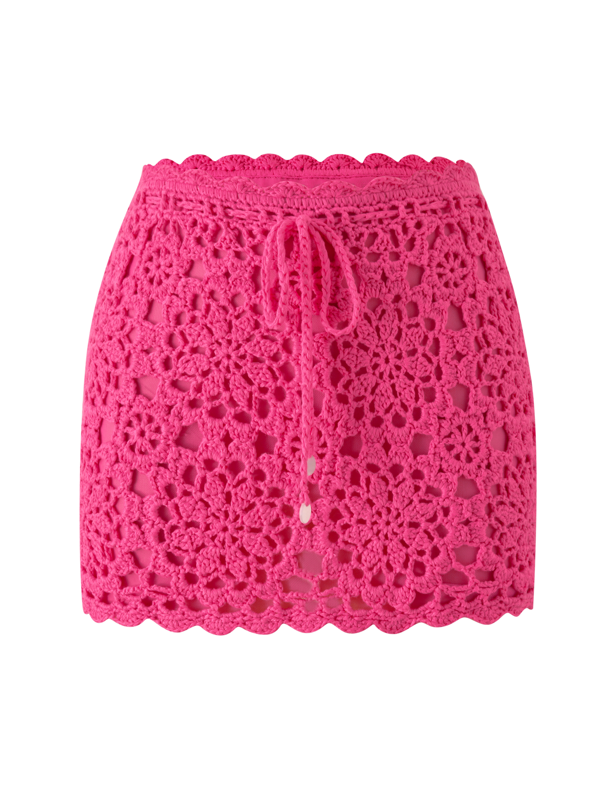 The SASHA CROCHET MINI SKIRT - HOT PINK by TIGERMIST features a vibrant floral pattern, scalloped hem, and drawstring waist—perfect for vacation, shown here on a white background.