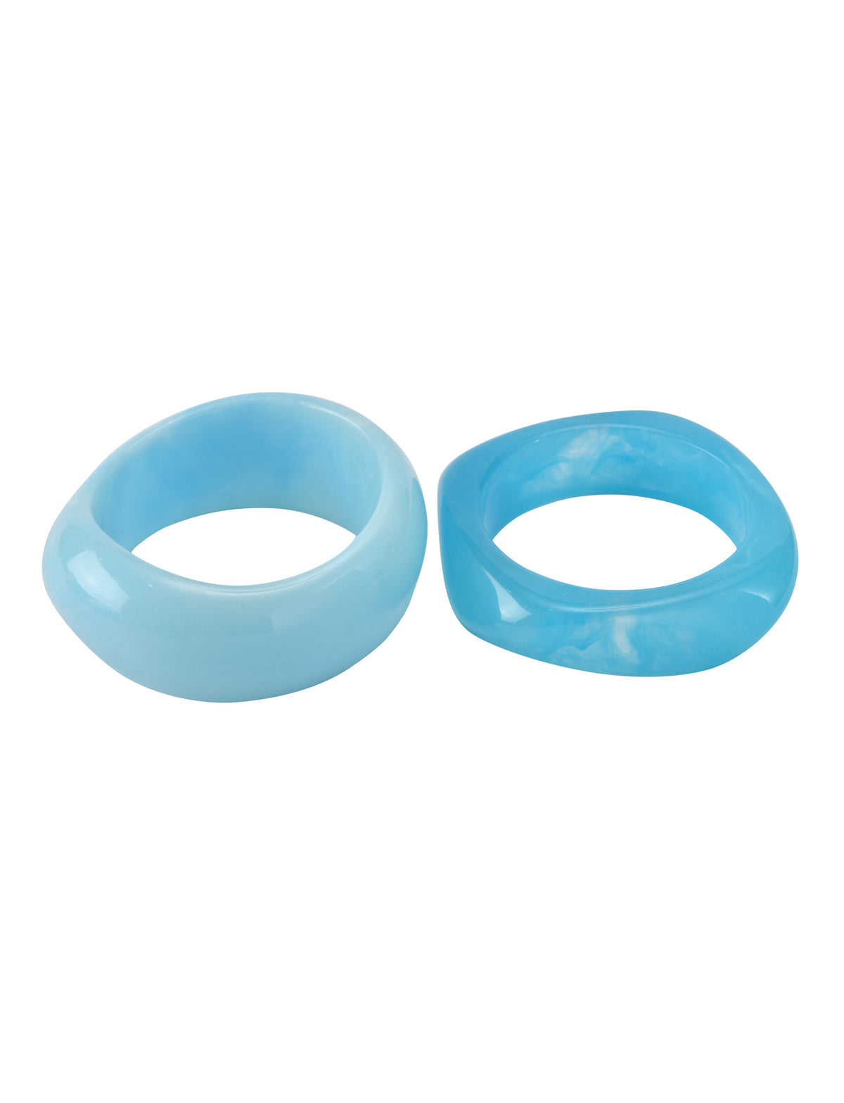 The MIKAH BANGLE SET - AQUA by TIGERMIST features two chunky resin rings in blue tones, side by side like a vibrant acrylic bangle set, displayed on a crisp white background.