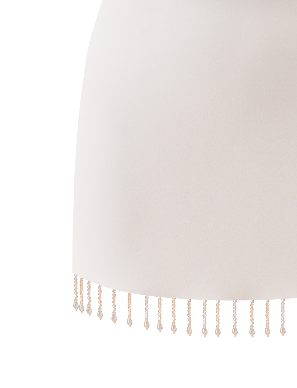 The TIGERMIST AUBRIELLA TASSLE MINI SKIRT in cream features a straight hem accented with delicate beaded tassels that hang evenly along the edge.