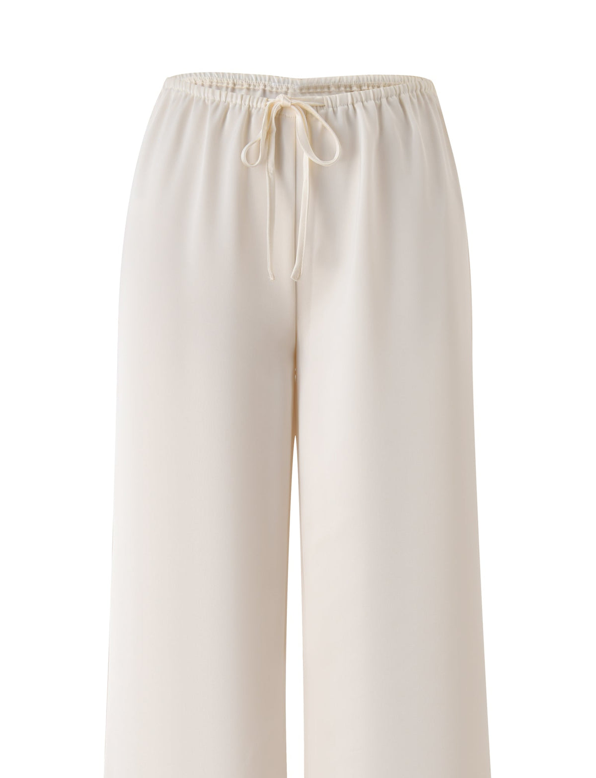 The MAURA PANT - WHITE by TIGERMIST showcases a cream-colored, wide-leg silhouette with an adjustable elastic waistband and drawstring for a comfortable fit, displayed against a white background.