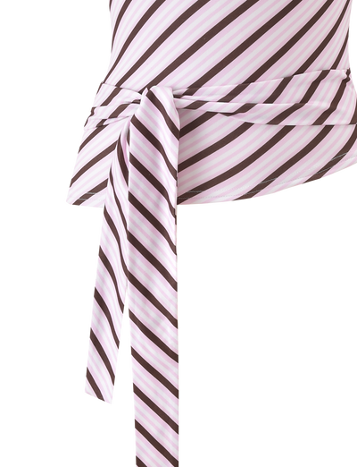Close-up of the TIGERMIST LYLE ONE SHOULDER TOP - PINK STRIPE, featuring diagonal white, pink, and brown stripes, a one-shoulder design, and a tied fabric waistband, set against a plain white background.