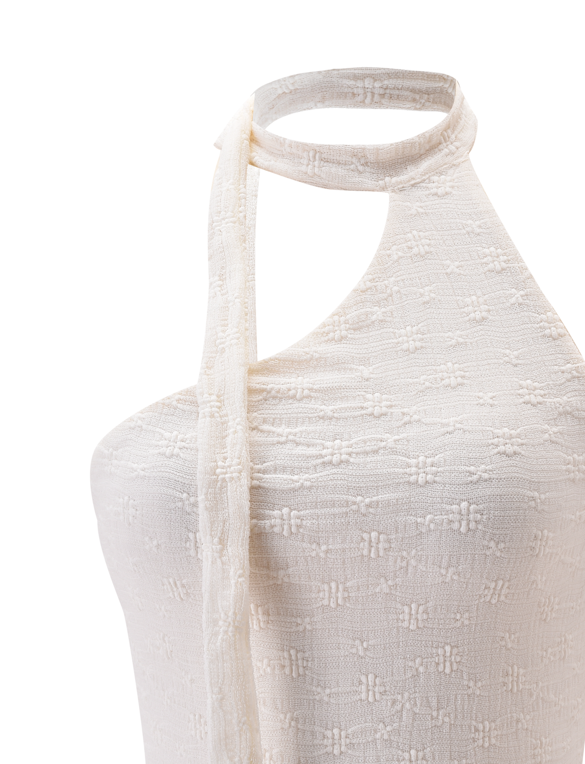 Close-up of the TIGERMIST MYLAH ONE SHOULDER TOP in ivory, showcasing a textured geometric fabric, asymmetrical one-shoulder neckline, and a thin matching halter strap.