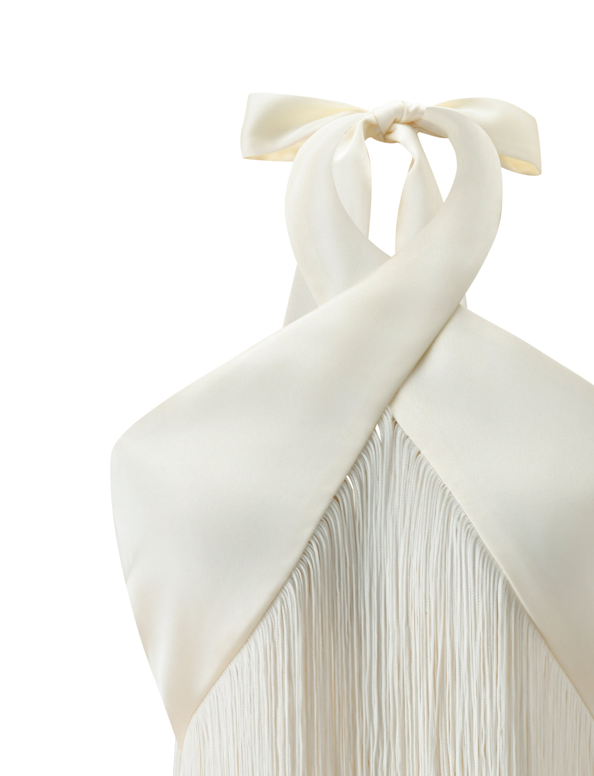 ALINDA TOP - CREAM, a halter top featuring a criss-cross wrap neckline, tie-neck detail, and long fringe in a cropped length.