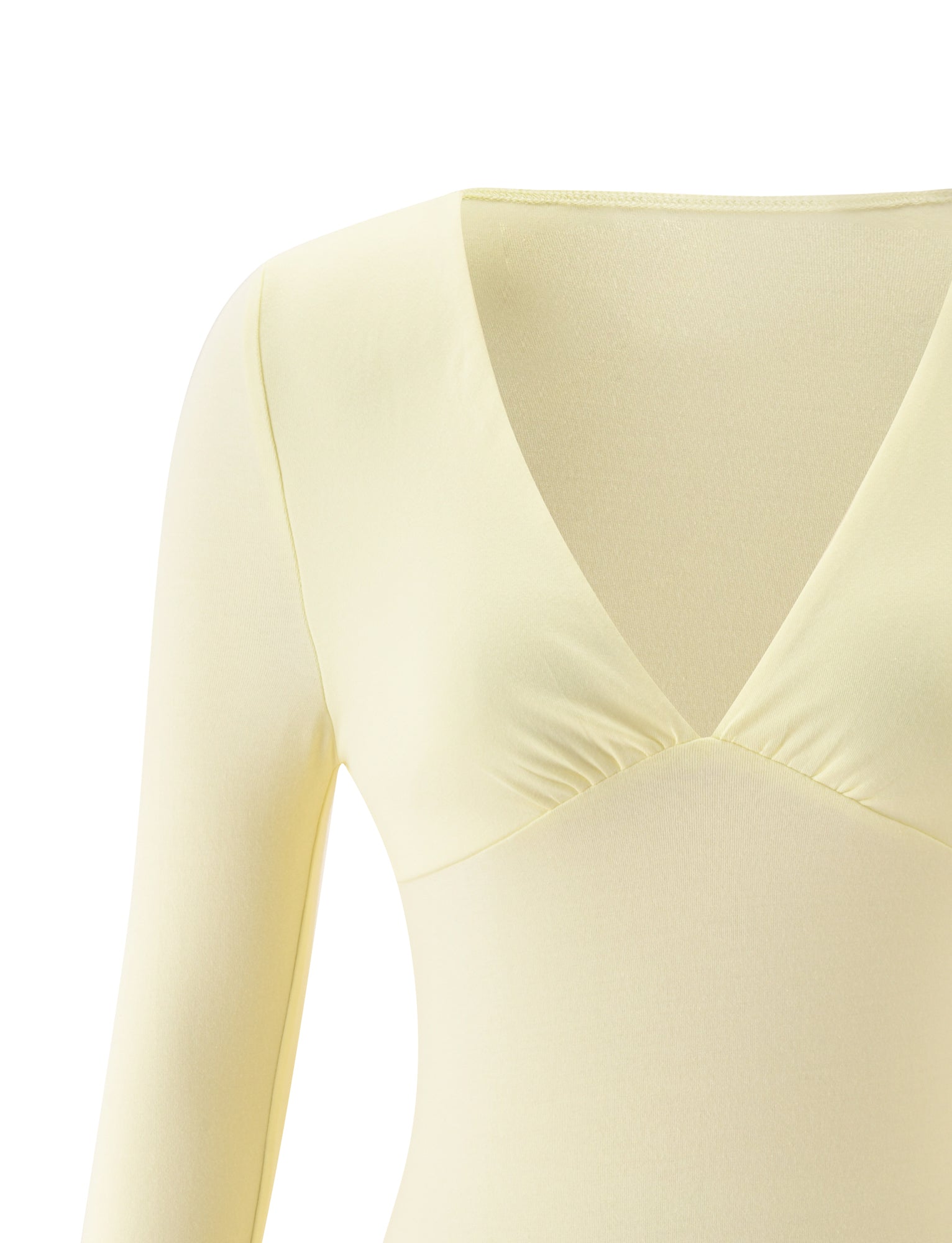 Here's a rewritten version using your product data: Close-up of the TIGERMIST SANDI TOP in butter yellow, showcasing its long sleeves, V-neckline, and subtle gathering beneath the bust. Only the upper section of this ideal brunch top is visible against a white background.