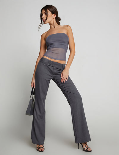 A woman wearing the HARRIETT TUBE TOP in grey from TIGERMIST.