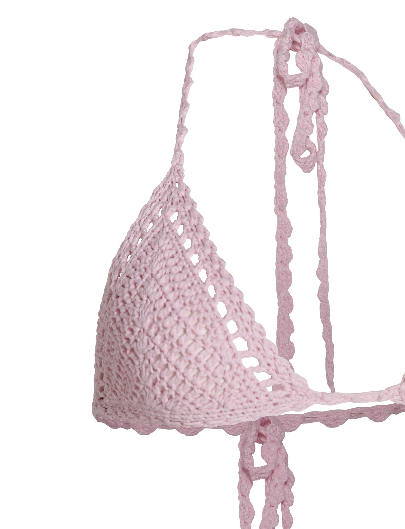 A close-up of the CORA BIKINI TOP - PINK : BABY PINK by TIGERMIST, showcasing the detailed handcrafted stitching. The bikini top features a triangular shape with adjustable ties at the neck and back. Its soft, slightly open-weave texture gives it a delicate and airy appearance.