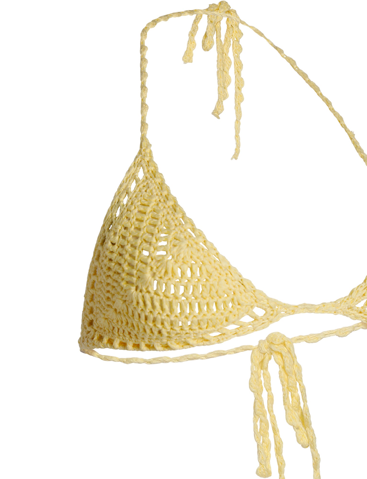 A close-up image of the CORA BIKINI TOP - YELLOW : LEMON from TIGERMIST showcases a beautifully designed bikini top with triangular cups and intricate, handwoven patterns. The strings are also crocheted, with one extending upwards to form a halter-neck tie and another stretching out for the back tie.