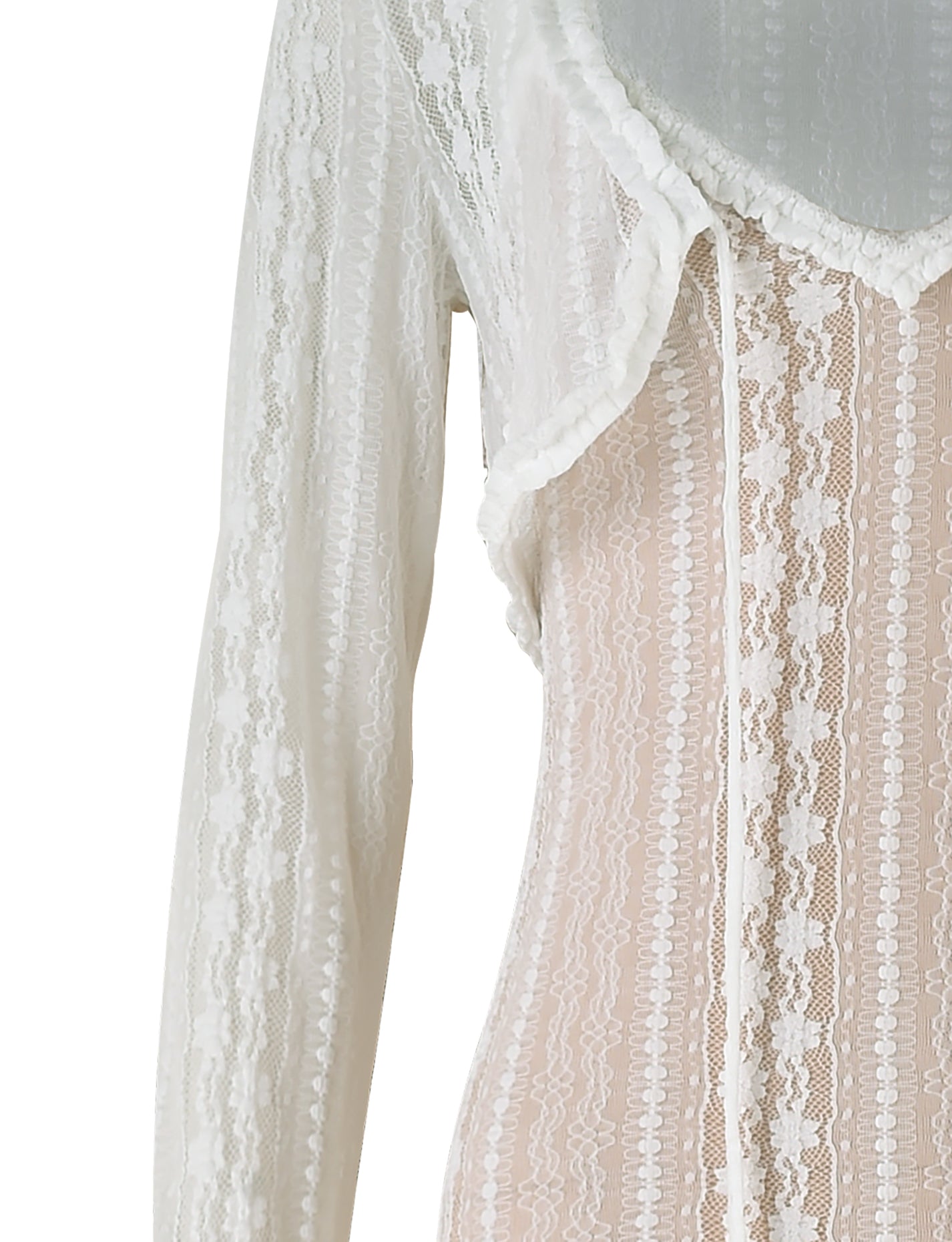 An image of a close-up view of the TIGERMIST Sopha Two Piece Maxi Dress in white. The dress features a delicate, intricate pattern and a V-neckline with ribbon details. The lace material appears sheer, showcasing a beautiful, vintage-inspired design.
