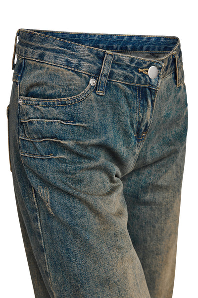 Close-up of the I.AM.GIA DYLAN JEAN - BLUE DENIM, showcasing low-waist fit, button closure, front pockets, and vintage-inspired faded and distressed denim details.