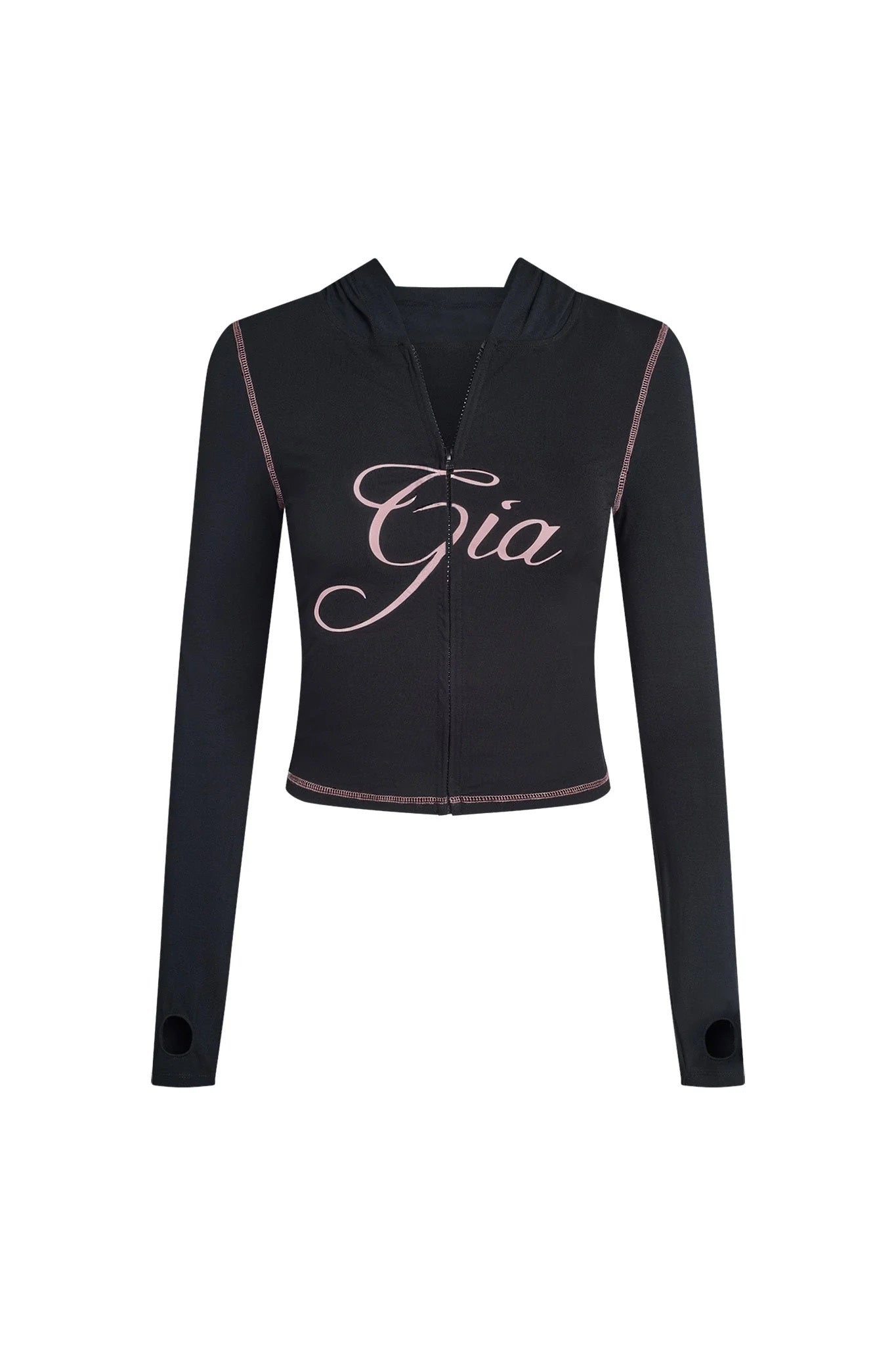 The BLARE HOODIE by I.AM.GIA is a black, long-sleeve, zip-up cropped hoodie with pink stitching, thumb holes, and "Gia" in bold pink cursive across the chest—ideal for a signature bodycon look.