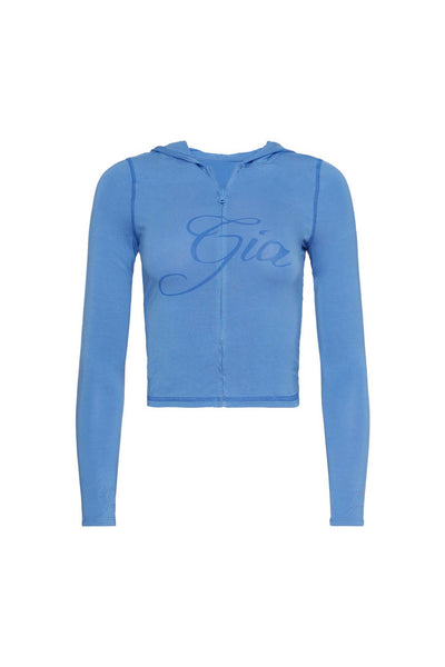 The BLARE HOODIE - BLUE by I.AM.GIA is a fitted, long-sleeve, cropped bodycon zip-up hoodie with visible stitching and "Gia" in cursive across the chest.