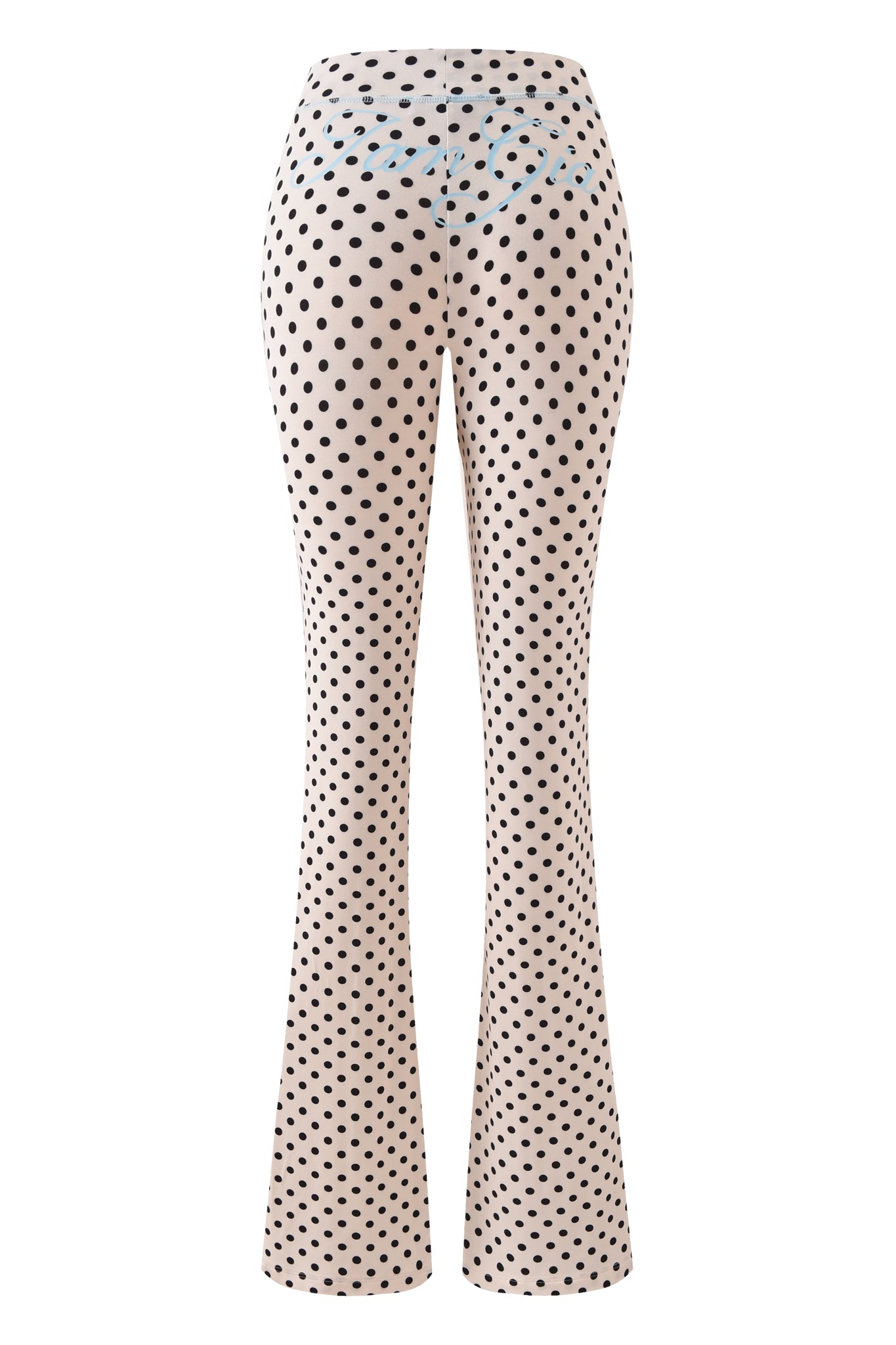 The I.AM.GIA BLARE TRACKPANT in Cream Polka Dot features a high-waisted, flared silhouette with a cream background and black polka dots, shown from the back.