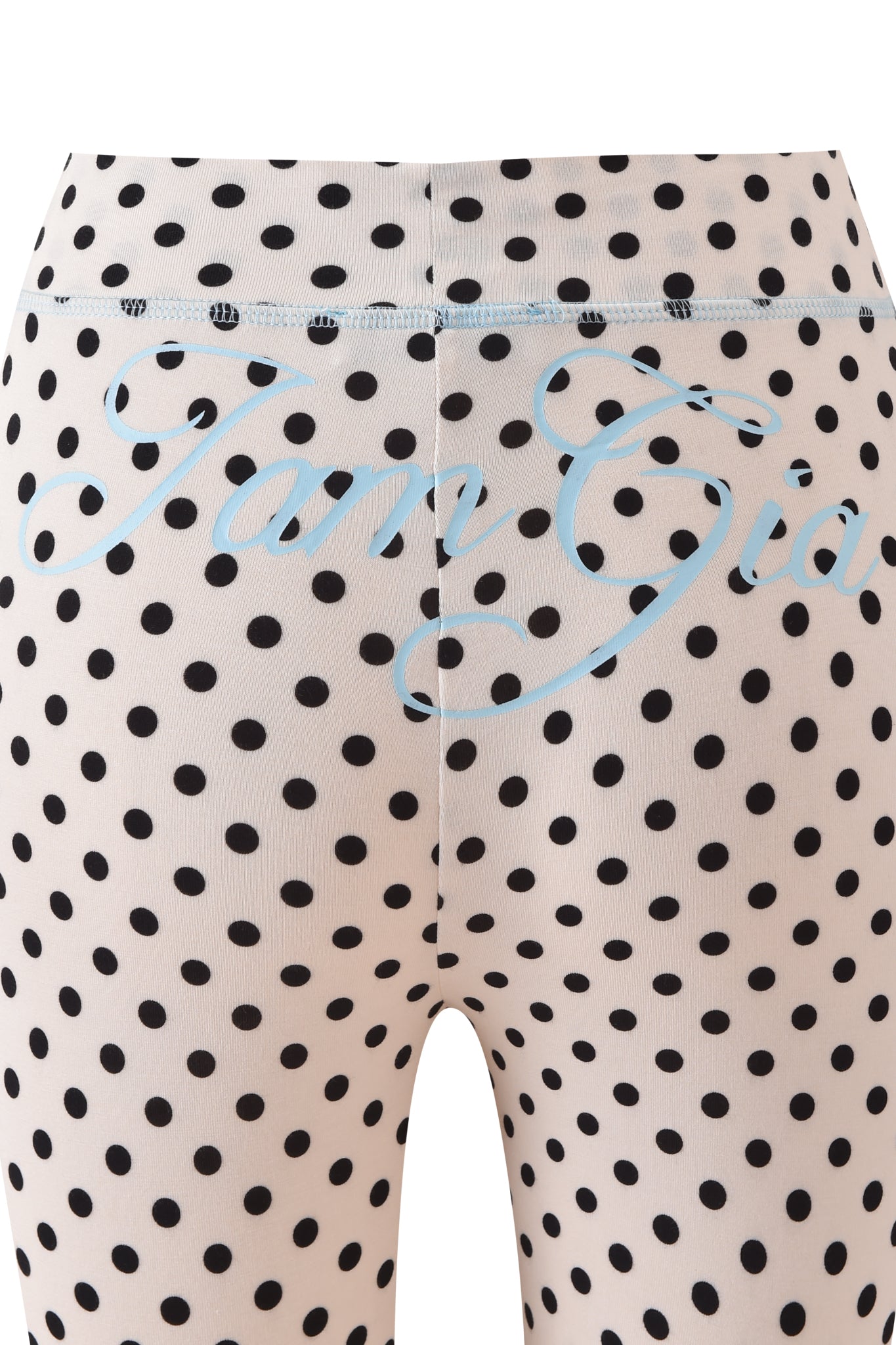 Close-up of the I.AM.GIA BLARE TRACKPANT in cream polka dot, featuring playful spots and light blue cursive "Fiorucci" text across the waistband and upper back.