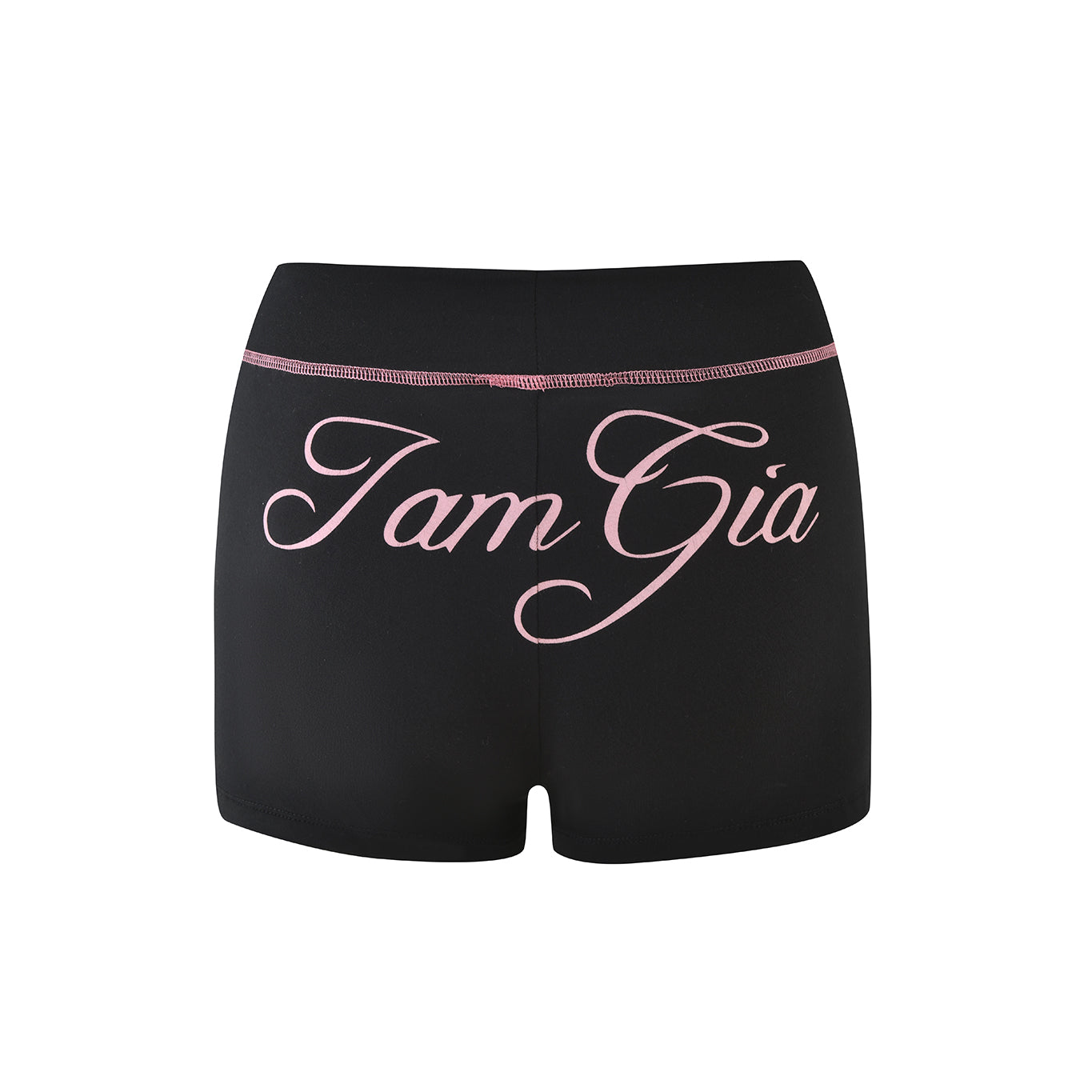 The BLARE SHORT - BLACK by I.AM.GIA features pink decorative stitching at the waistband and bold pink "I.AM.GIA" script across the back, offering mid-rise comfort with standout style.