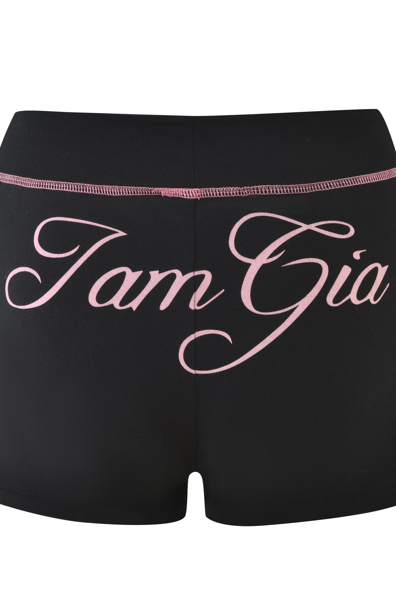 The BLARE SHORT - BLACK by I.AM.GIA features pink stitching and bold pink cursive “I am Gia” lettering on the back. These mid-rise shorts add a stylish statement to any look.