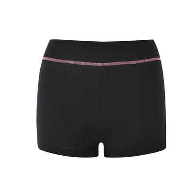 The I.AM.GIA BLARE SHORT - BLACK features a high waistband and a subtle pink stitched line near the top, displayed against a plain white background.
