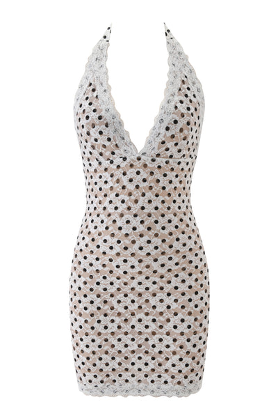 The GEM MINI DRESS - WHITE by I.AM.GIA is a sleeveless, halter-neck mini dress with a deep V-neckline and white lace overlay featuring circular cutouts over a chic nude underlayer.