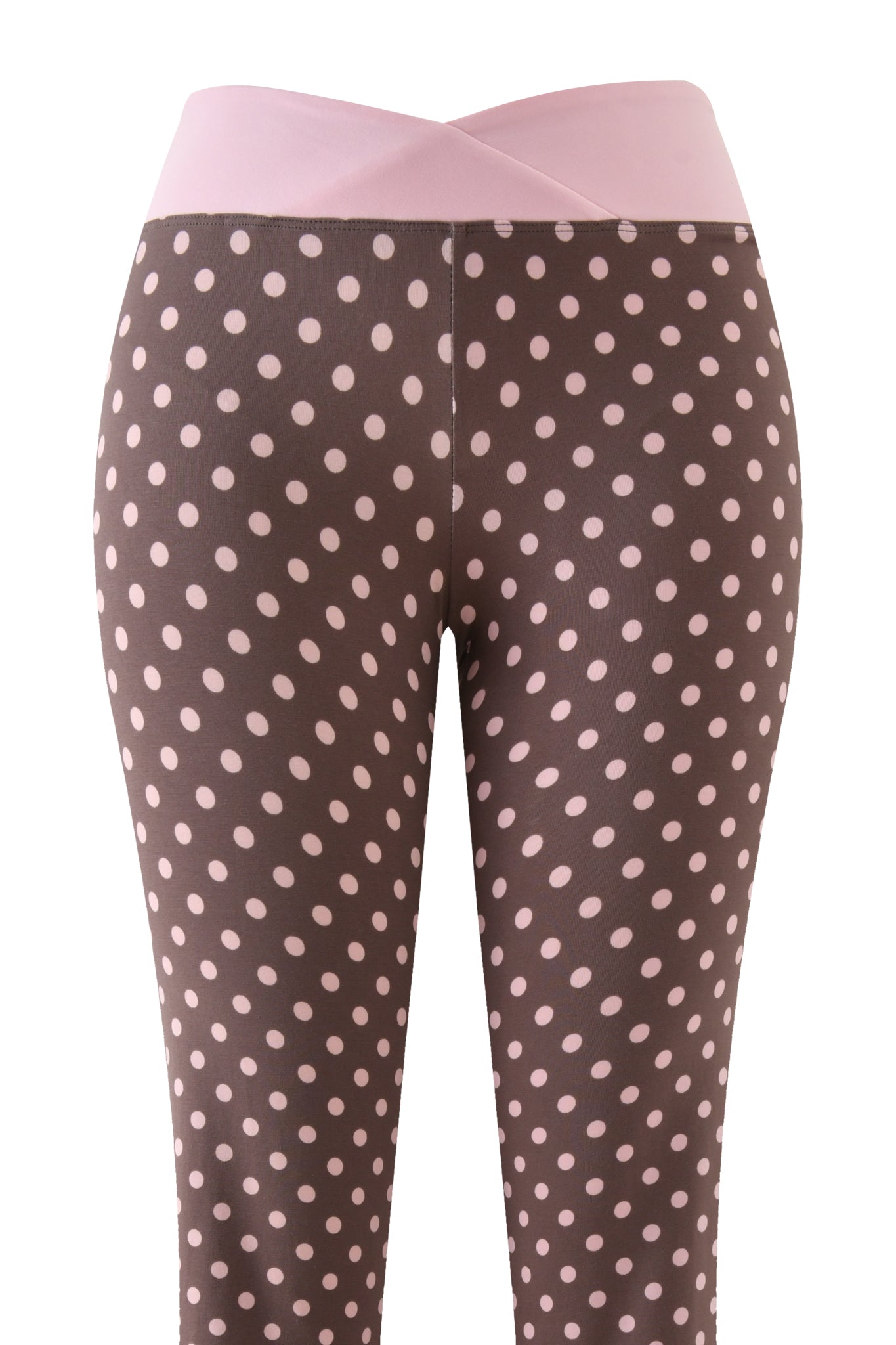 The BLARE CROSSOVER PANT - PINK CHOCOLATE by I.AM.GIA features a high-waisted fit, pink crossover waistband, and brown fabric with light pink polka dots. Photo shows front view from waist to ankles.