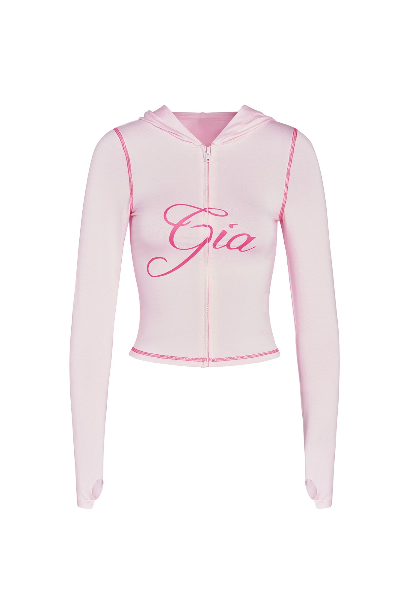 The I.AM.GIA BLARE HOODIE in pastel pink is a cropped zip-up with long sleeves, thumb holes, and "Gia" in bold, cursive dark pink on the front for standout style.