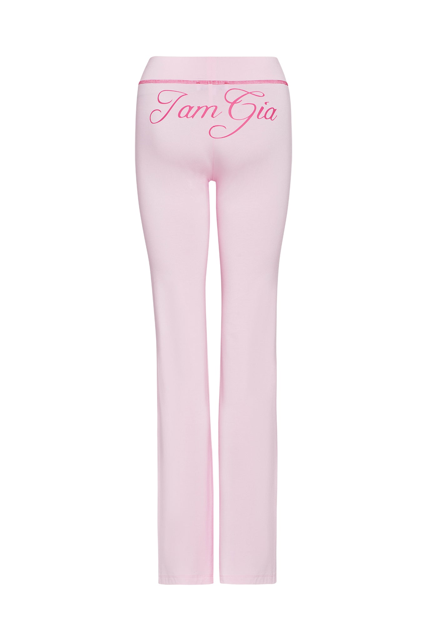 BLARE TRACKPANT in pastel pink by I.AM.GIA, shown from the back with "I am Gia" in large, cursive pink letters across the waistband for a signature style.
