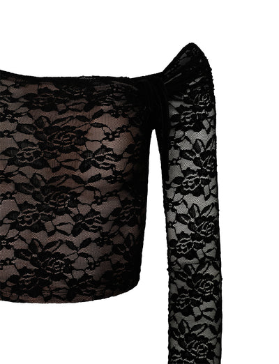 Close-up of the CYD L/S TOP - BLACK from TIGERMIST, featuring a floral lace pattern. The top includes a single long sleeve and a square neckline, showcasing the intricate lace design on the fabric. The white background highlights the textures and details of the lace.
