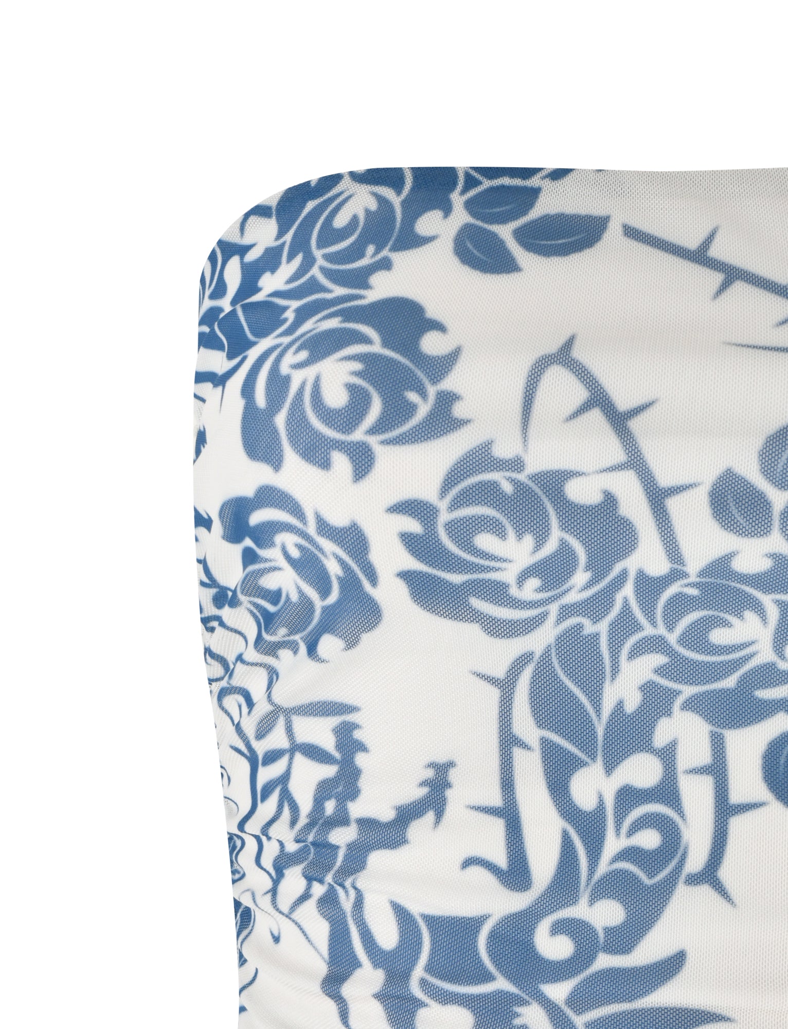 Close-up image of the TIGERMIST HARRIETT TUBE TOP in blue, showcasing its intricate tattoo print on a white base. The visible section features detailed and stylized roses and leaves, creating an elegant and classic design that embodies the sophisticated aesthetics often seen in TIGERMIST collections.