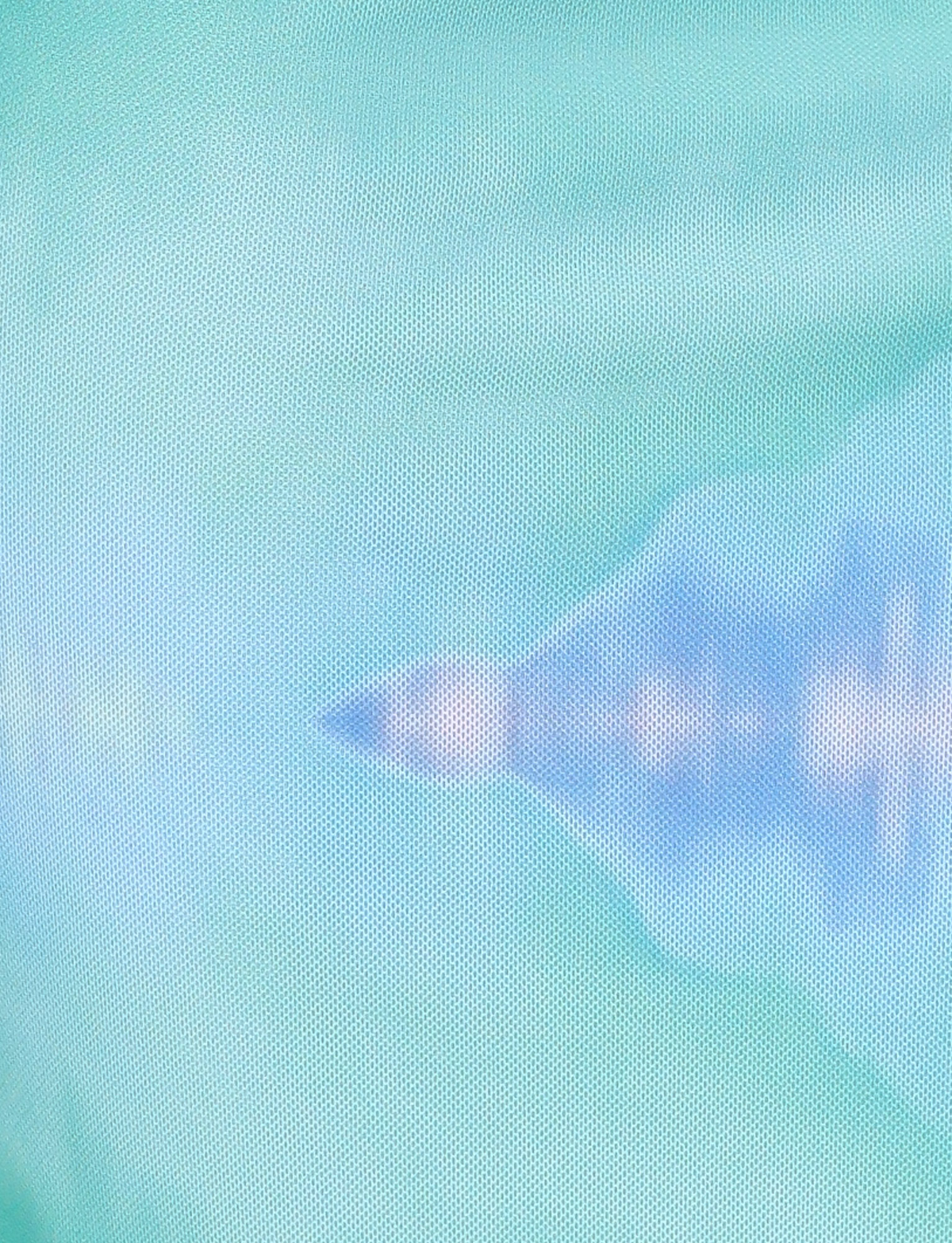 A shadowy silhouette of a jet appears behind a blue-green mesh, evoking the exclusive, abstract print of the TIGERMIST ARDON MAXI DRESS - BLUE : MACRO FLORAL : BLUE HIBISCUS.