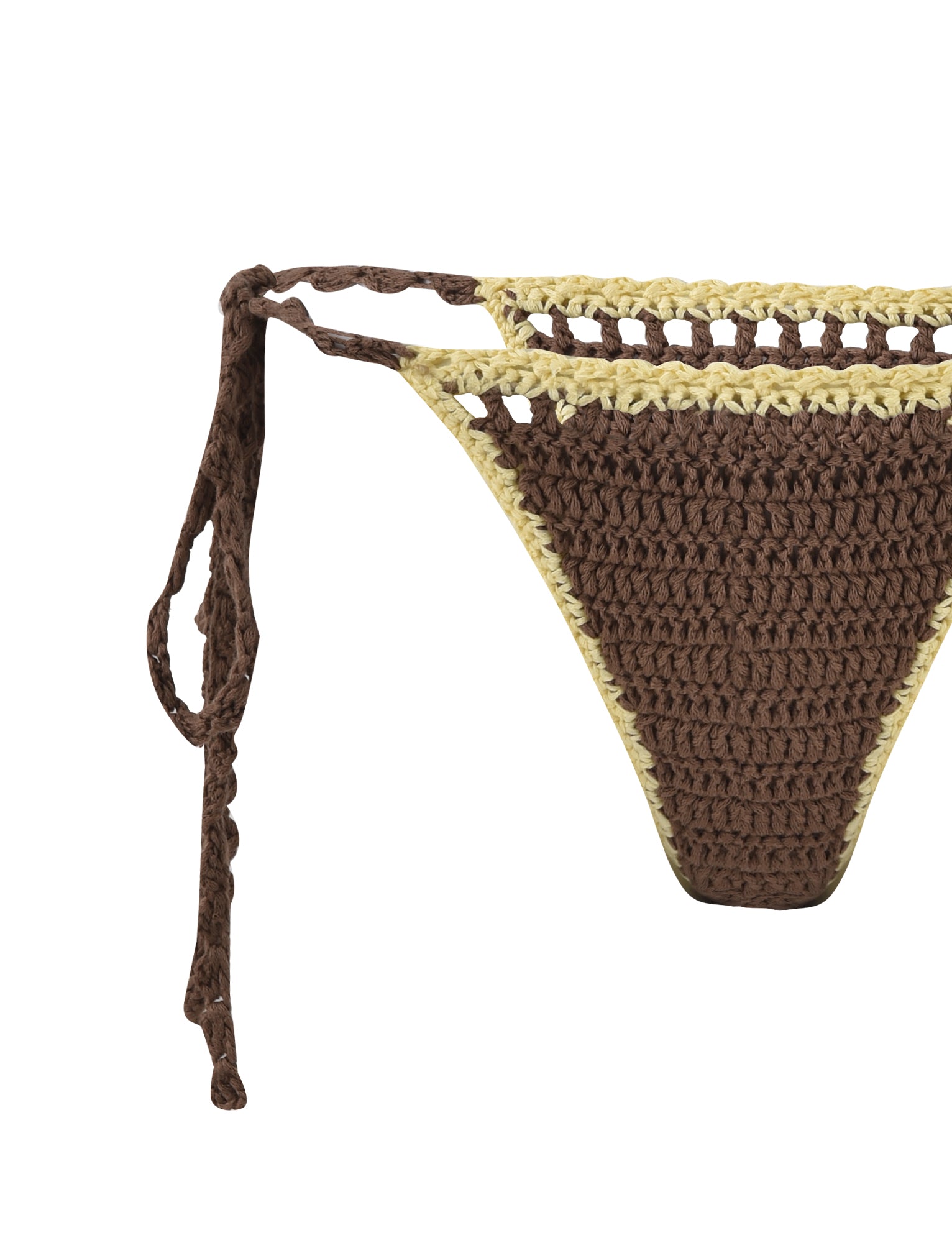 Close-up of the CORA BIKINI BOTTOM - BROWN : EARTHY, a handmade crochet piece by TIGERMIST featuring brown and beige yarn. This piece highlights a tie-side design and delicate crocheted texture, showcasing intricate craftsmanship and a minimalist style.