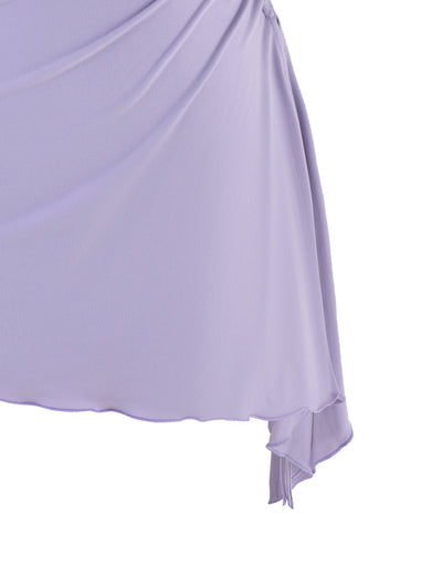 An intimate view of the TIGERMIST XENIA MINI DRESS - PURPLE : LILAC fabric shows it draped in an asymmetric fashion, offering a soft and flowing aesthetic. The material looks lightweight and sheer, featuring gentle folds with a subtle sheen similar to that of purple lilac.
