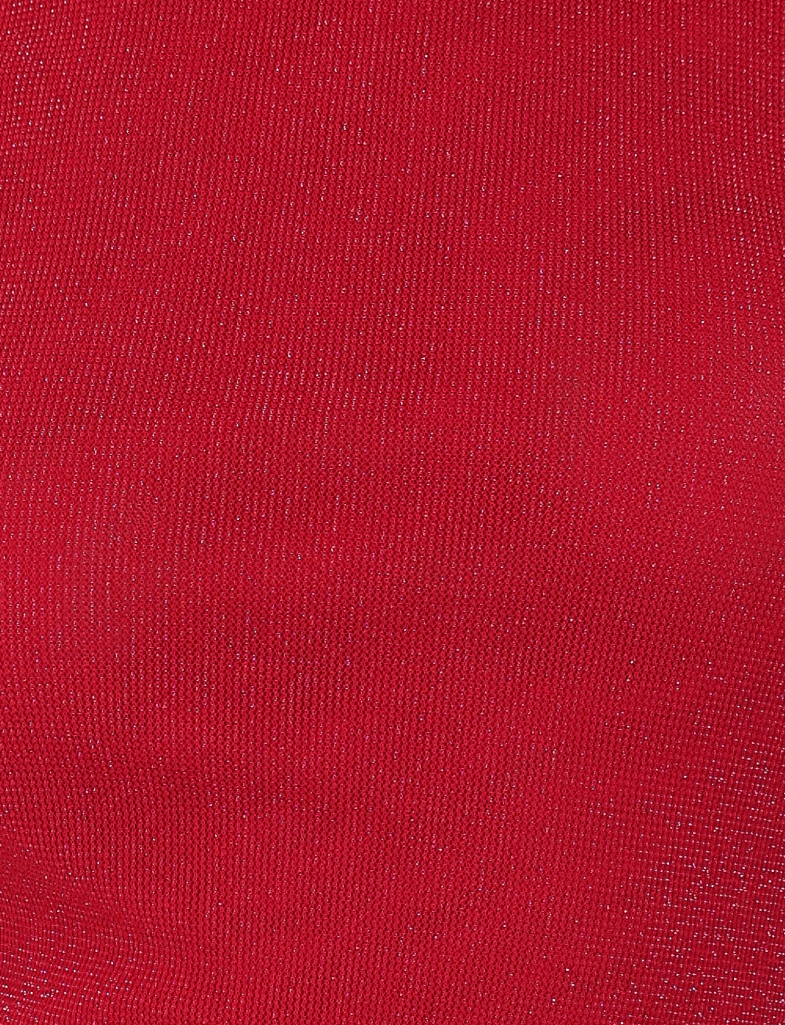 Close-up of TIGERMIST’s COBI TANK - RED : SPARKLE, featuring textured red shimmer jersey fabric with fine metallic threads throughout for a subtle, sparkling effect—ideal for a statement asymmetrical top.