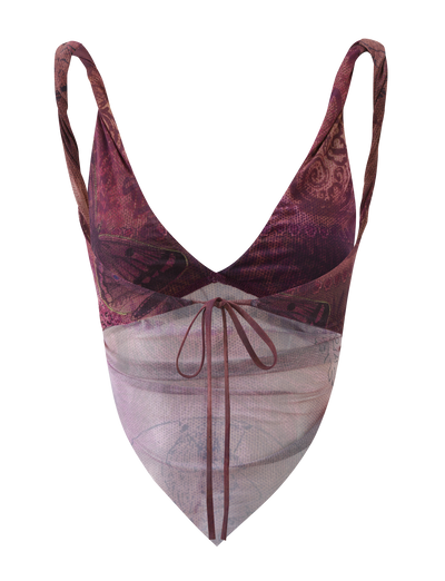 The TIGERMIST THEO TOP - PLUM BUTTERFLY PAISLEY is a sleeveless V-neck crop featuring maroon and purple butterfly paisley print, a sheer light pink panel with a front tie, thin straps, and adjustable back ties for the perfect fit.
