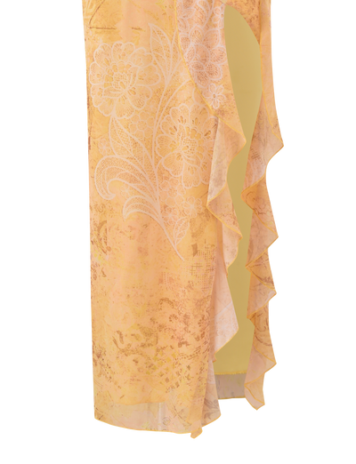 Close-up of the TIGERMIST THEO SKIRT in Lemon Butterfly Paisley, featuring a floral pattern, white lace overlay, ruffled asymmetrical edge, and an opening that reveals a yellow inner lining.