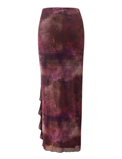 The TIGERMIST THEO SKIRT - PLUM BUTTERFLY PAISLEY is a long, fitted high-waist skirt with a sheer purple and burgundy butterfly paisley print, abstract patterns, and a ruffled side detail.