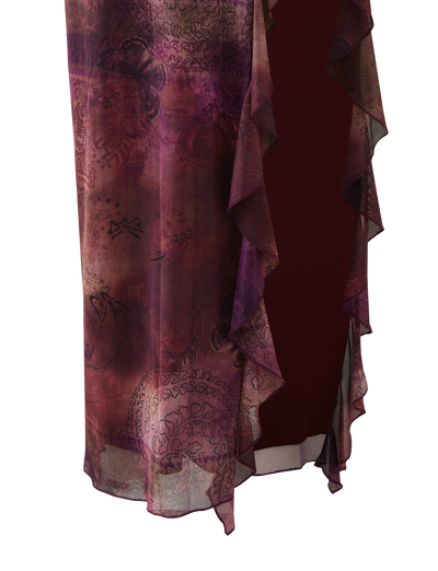 The TIGERMIST THEO SKIRT in Plum Butterfly Paisley features sheer purple and burgundy paisley print with delicate butterfly patterns, ruffled edges, and is draped over a dark red background.