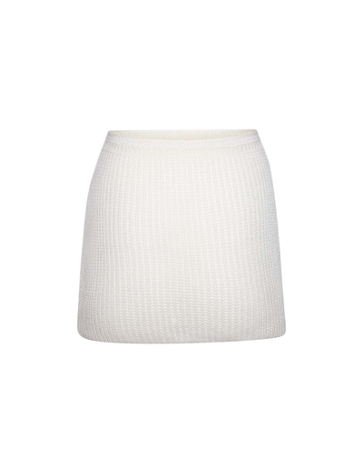 The TIGERMIST MACAULEY MINI SKIRT in white features a ribbed knit design and bodycon fit, showcased against a plain white background.