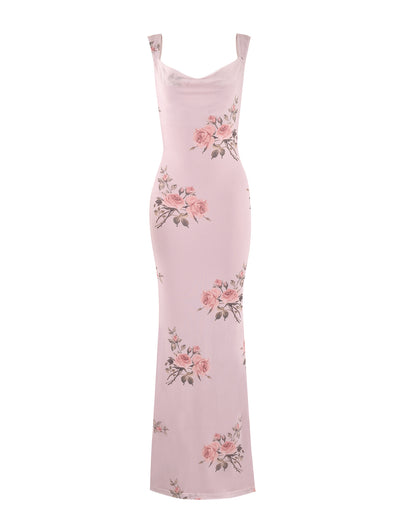 The MORANA DRESS - PINK : FLORAL by TIGERMIST is a long, sleeveless dress with a cowl neckline and a lovely floral pattern featuring pink roses and green leaves. Designed with a fitted silhouette, it gracefully reaches the ankles.