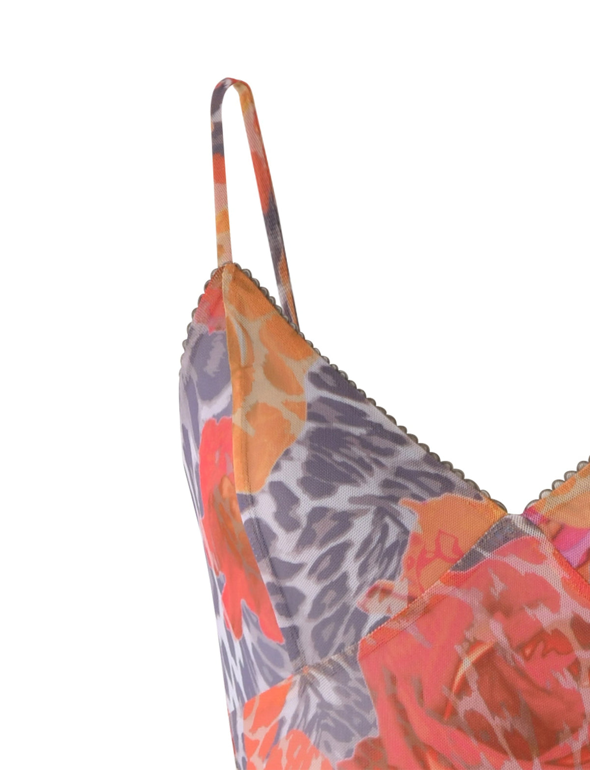Close-up view of the TIGERMIST JULIANNA DRESS - MULTI : LEOPARD : ORANGE LEOPARD, a sleeveless dress with thin shoulder straps, showcasing a vibrant floral and abstract pattern in shades of orange, red, and purple. The fabric appears light and slightly translucent.