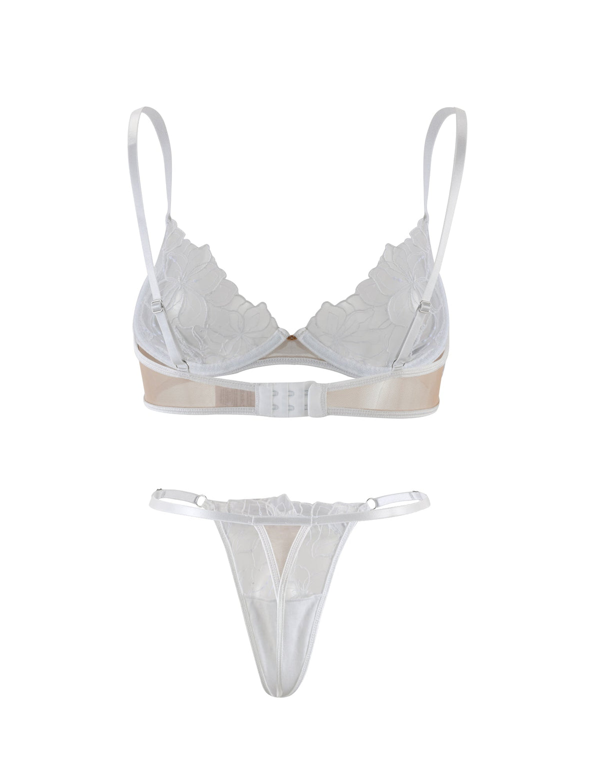 The LAURA SET - WHITE by TIGERMIST features a white lingerie set including a lace bra with thin adjustable straps and a clasp at the back, paired with a matching lace thong. The bra is adorned with floral lace detailing, while the thong showcases a sheer mesh panel accented with similar lace designs.