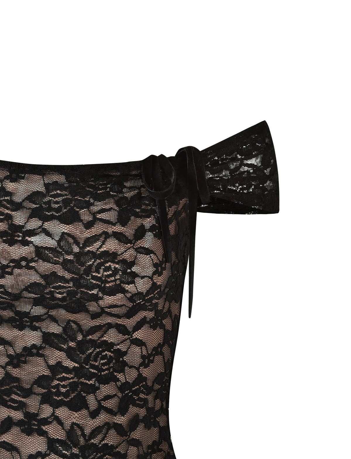 A close-up of the CYD TOP - BLACK by TIGERMIST reveals its intricate floral lace patterns. The top is adorned with a large, elegant bow detail on the shoulder, adding a touch of sophistication. The see-through black lace allows a glimpse of a beige background underneath, showcasing Tiger Mist's signature style.