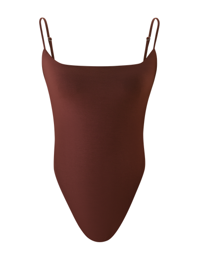 The TIGERMIST MINERVA BODYSUIT in chocolate is a sleeveless piece with thin adjustable straps, high-cut leg, G string bottom, and a smooth minimalist design, shown against a white background.