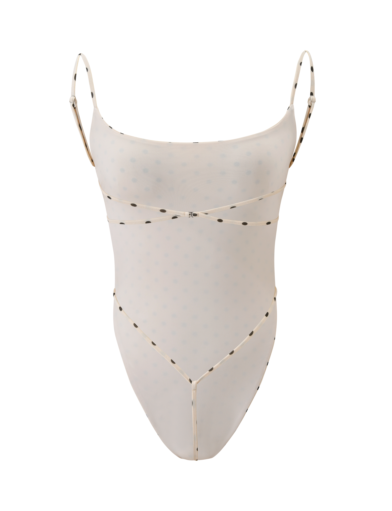 The MINERVA BODYSUIT - CREAM DOT by TIGERMIST features a sheer, pale beige fabric with small dots, thin adjustable straps, minimal trim, and a bodycon fit. Its high-cut leg adds to its lightweight and elegant feminine look.