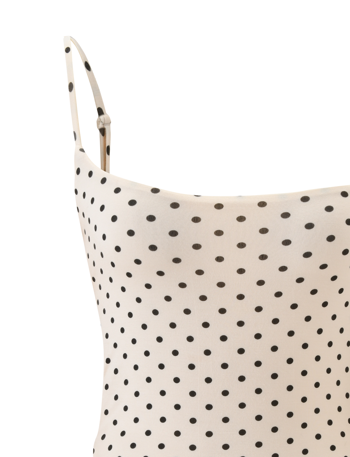 Close-up of the TIGERMIST MINERVA BODYSUIT - CREAM DOT featuring black polka dots, a thin adjustable shoulder strap, and smooth lightweight fabric, designed for a sleek bodycon silhouette.