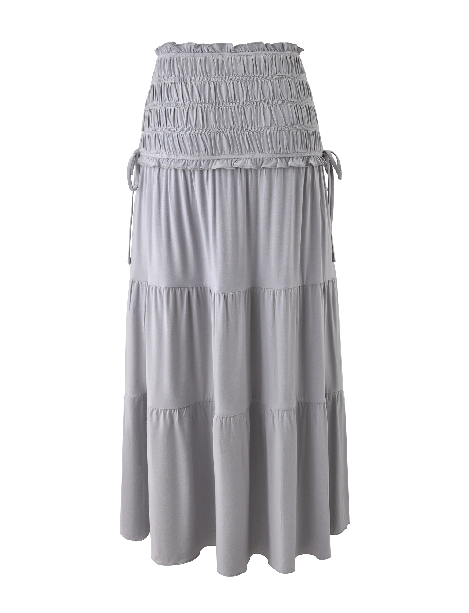 The TIGERMIST DENALI MAXI SKIRT in Dove Grey is crafted from soft modal fabric and features a smocked waistband with side drawstring ties, shown against a plain white background.