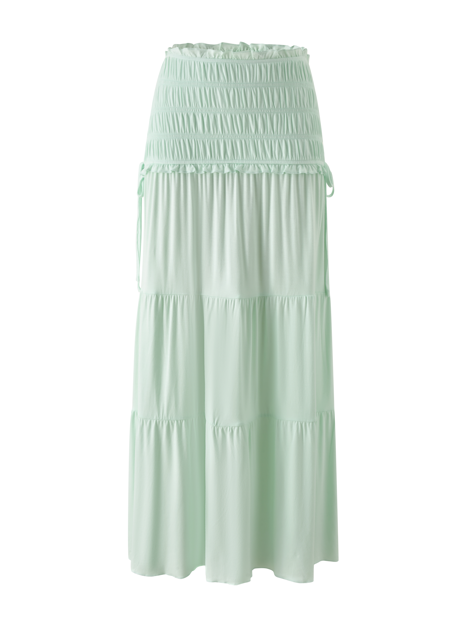 The TIGERMIST DENALI MAXI SKIRT in Soft Mint features a shirred waistband, adjustable side ties, and tiered layers. Crafted from soft modal fabric, this relaxed maxi skirt offers effortless and casual style.