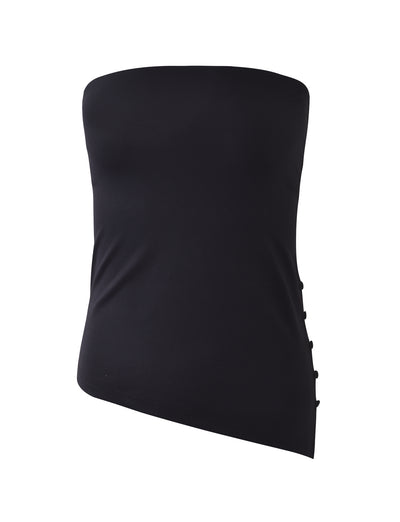 The "INDIRA TOP - BLACK" from TIGERMIST is a black, strapless tube top with an asymmetrical hemline. The right side is adorned with functional buttons running vertically for added detail. The fabric appears smooth and form-fitting, emphasizing its sleek and modern design.