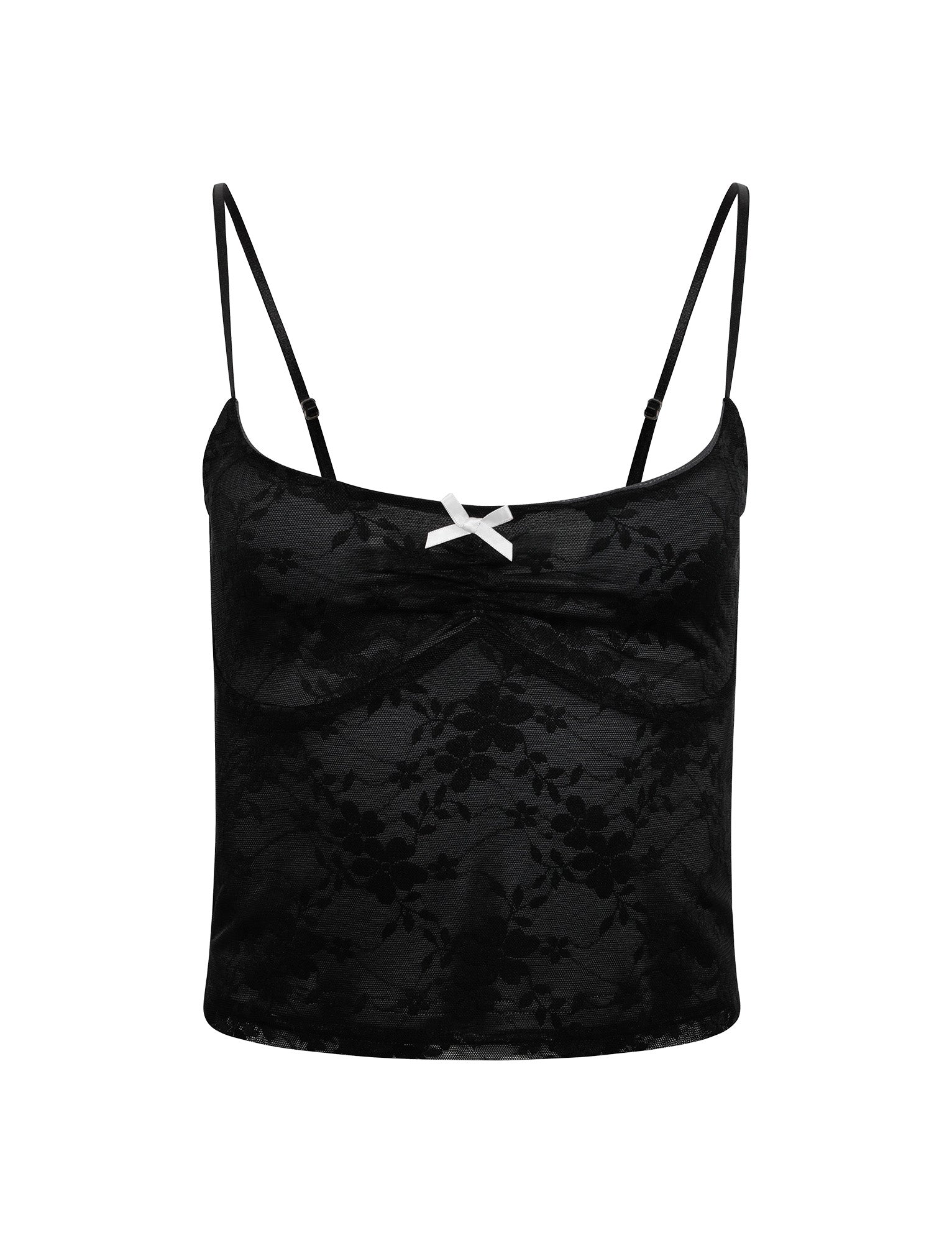 The image showcases the Rachelle Top in black from TIGERMIST, featuring delicate thin spaghetti straps. The top boasts a subtle floral lace pattern and a small white bow at the center of the neckline. With its fitted, slightly cropped design, it exudes a delicate and feminine aesthetic.