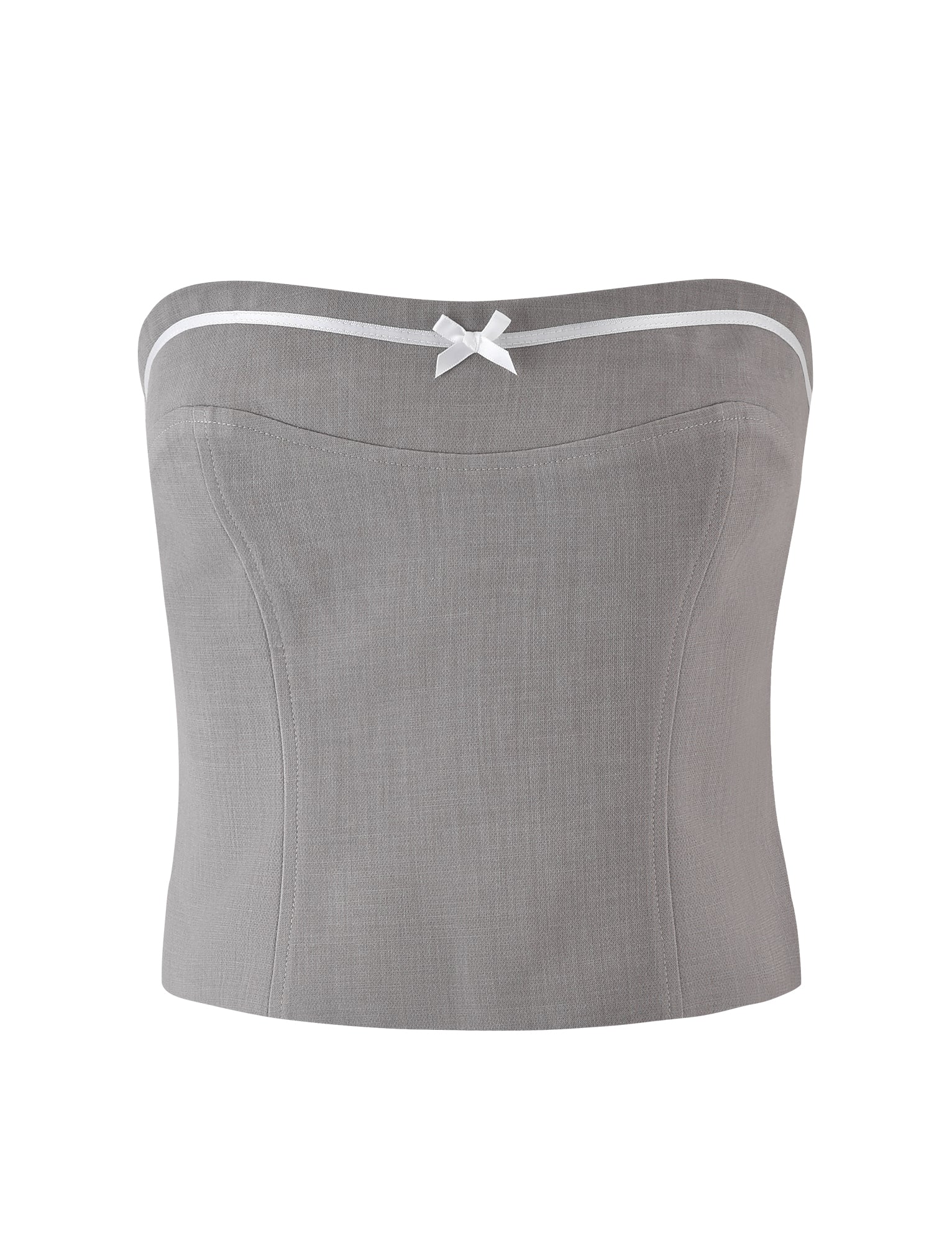 The LENINA TOP - GREY from TIGERMIST is a strapless, light grey top with a slight curve at the top hem. It features a white trim and a delicate white bow at the center front. The fabric has a light, textured appearance, and the top boasts a fitted, tailored shape.