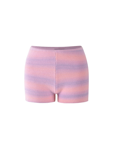 The YARRA SHORT - PINK/PURPLE : STRIPE by TIGERMIST are high-waisted, ribbed knit shorts featuring a pastel tie-dye pattern with shades of pink, purple, and blue. These shorts offer a snug fit and come with a seamless waistband.