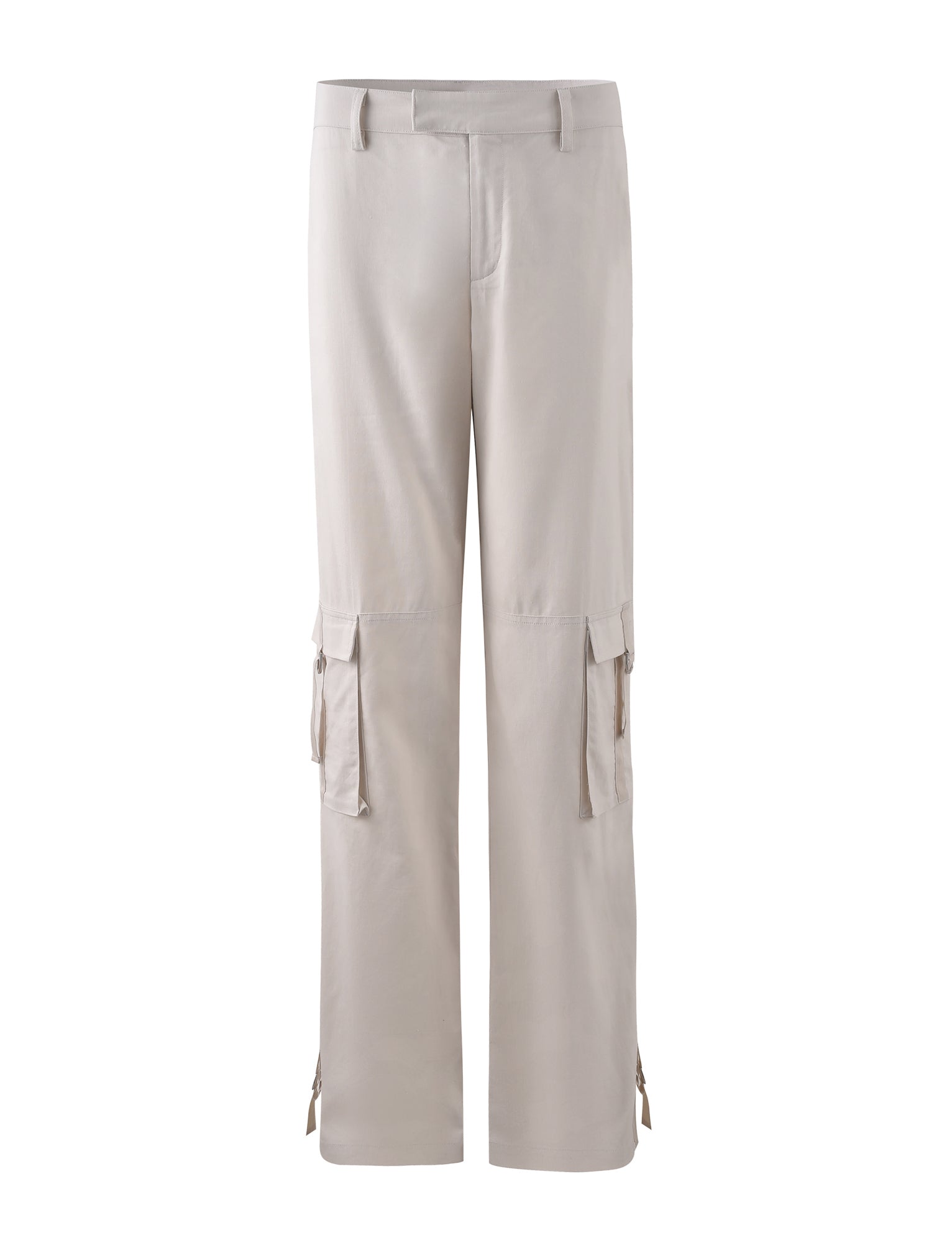 The KAYA PANT - WHITE : CREAM from TIGERMIST are a pair of cream-colored cargo pants featuring multiple side pockets and a relaxed fit. These pants come with belt loops, a button and zipper closure at the waist, and adjustable ties at the ankles. The material looks soft and comfortable.