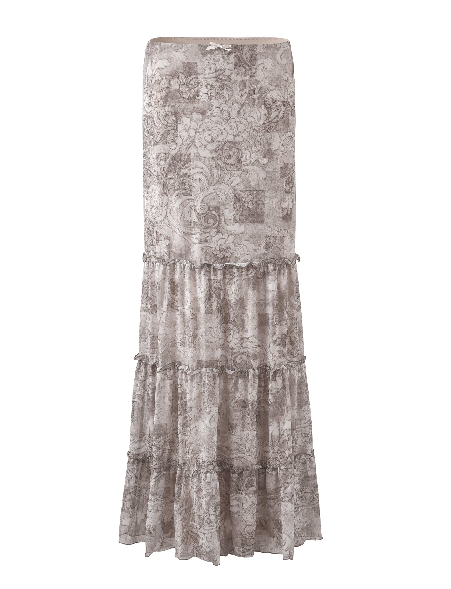 The ALESSIA SKIRT - BROWN: FLORAL ORNATE from TIGERMIST features a long, tiered design with a floral pattern in various shades of taupe and beige. It has a fitted waist and multiple ruffled layers, giving it a flowy, bohemian look.